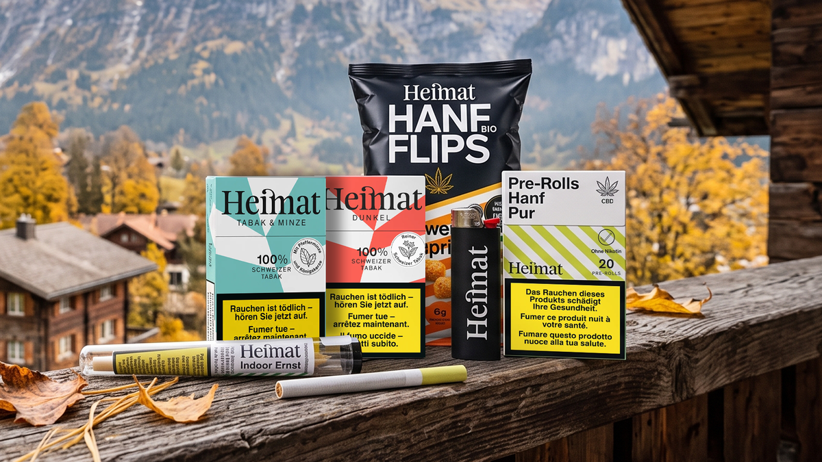 Heimat Produkte auf einem Holzbalkon vor herbstlicher Bergkulisse